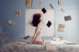 Woman with flying books representing things I Wish I Knew
