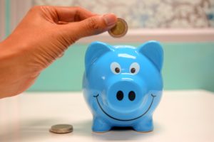 Smiling blue piggy bank representing me making a little bit of money.