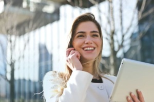 Delightful December - Smiling woman with computer